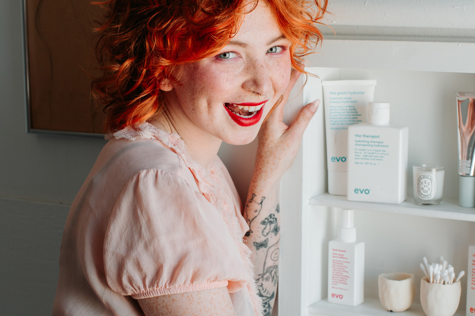 Woman at a medicine cabinet in a bathroom