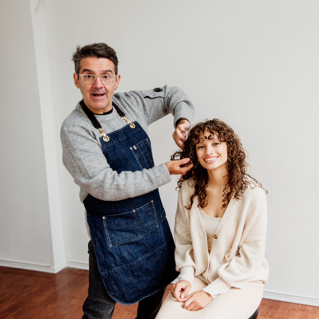 Philip salon owner with client that has curly hair